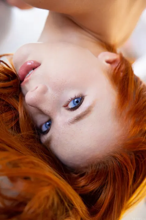 Redhead Pulls Her Top Down and Spreads Her Legs Wide – photo 19 of 21