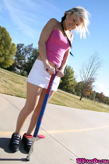 Blonde in Pigtails and Skirt Spreads Her Tight Pussy