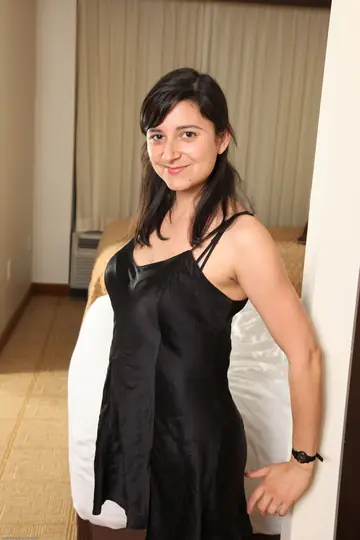 Petite Brunette Poses Nude Showing Her Hairy Pussy