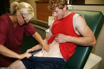 Carey Riley – Tall Mature Blonde in Glasses Jerks Cock in Uniform and Takes a Facial