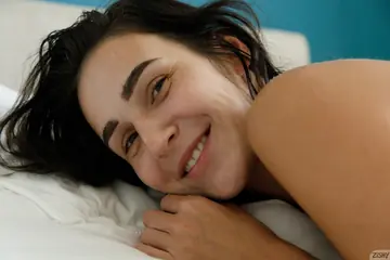 Brunette with Big Natural Tits Poses Nude Showing Petite Frame