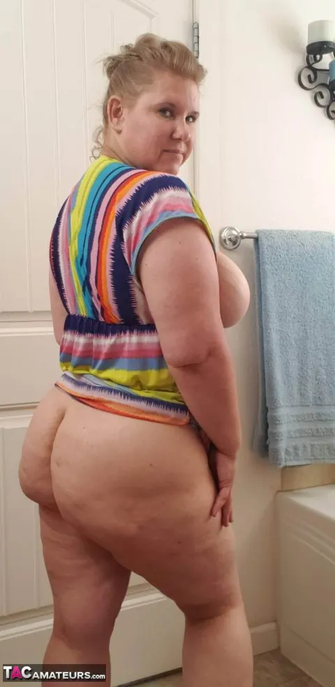 Busty Kris Ann: Mature Blonde BBW Strips Out of Her Dress and Poses Nude in the Bathroom – photo 7 of 20