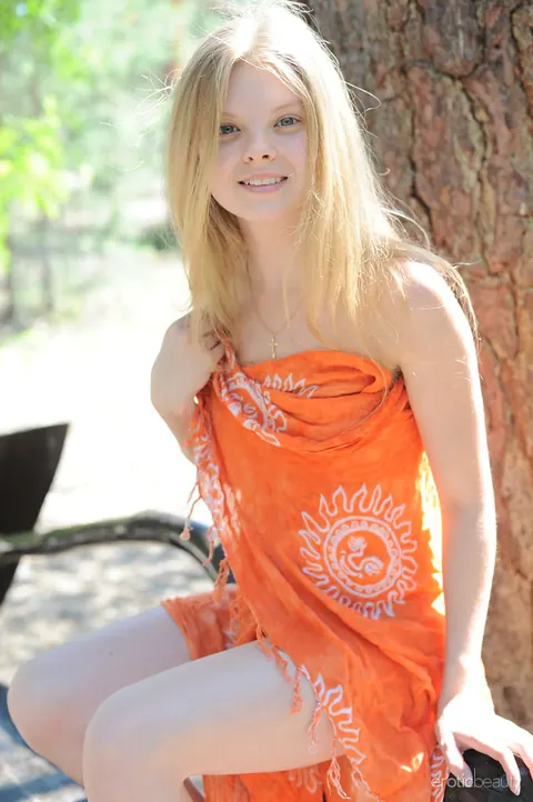 European Blonde Strips Nude on Outdoor Bench – photo 15 of 16