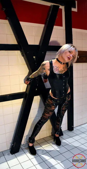 Tattooed Short-Haired Blonde Bound and Ball-Gagged in Leather
