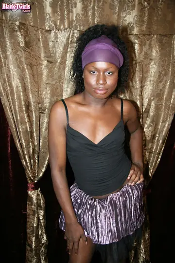 Ebony Trans Woman Strips Nude and Poses for the Lens