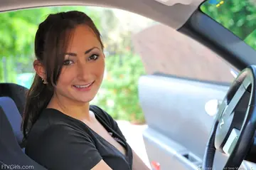 Busty Brunette Strips Out of Her Jeans in the Car