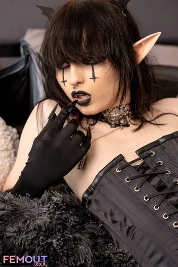Tattooed Trans Woman in Stockings Uses a Dildo