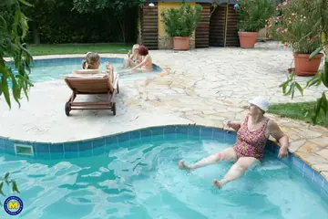 Enrika – Busty European MILF in Pigtails Joins a Lesbian Orgy by the Pool
