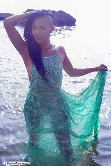 Sweet Julie – Petite Asian Brunette with a Tattoo Strips Nude and Poses