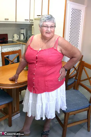 Busty British Brunette Bends Over in a Skirt to Show Her Curvy Figure