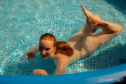 Julia Fleming: Tall Curvy Redhead Frees Her Breasts by the Pool – photo 15 of 16