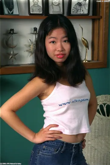 Asian Woman Removes Her White Panties and Spreads Her Hairy Pussy in Heels