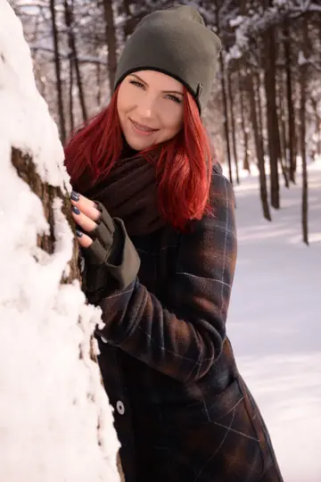Redhead Strikes Poses Outdoors While Staying Clothed