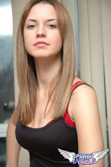 Woman in Red Lingerie Bends Over and Pulls Panties Aside