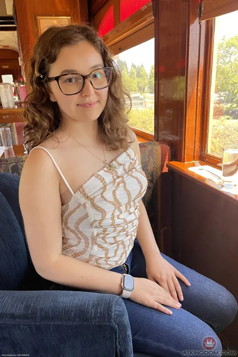 Leana Lovings: Petite Curly Brunette in a Dress and Glasses Spreads Her Shaved Pussy – photo 1 of 21
