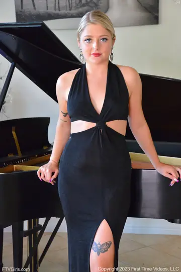 Blonde in a Skirt Fucks Herself with a Dildo at the Piano