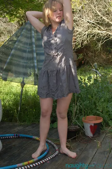 Slim Blonde Strips Off Her Dress and Spreads Her Hairy Pussy Outdoors