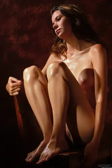 Skinny Brunette Oils Her Body and Spreads Her Legs