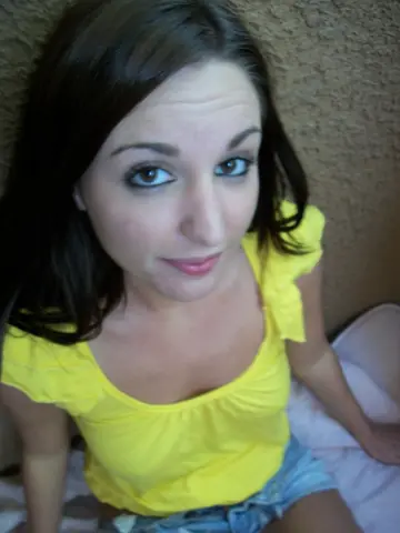 Busty Brunette Spreads Her Shaved Pussy in a Selfie