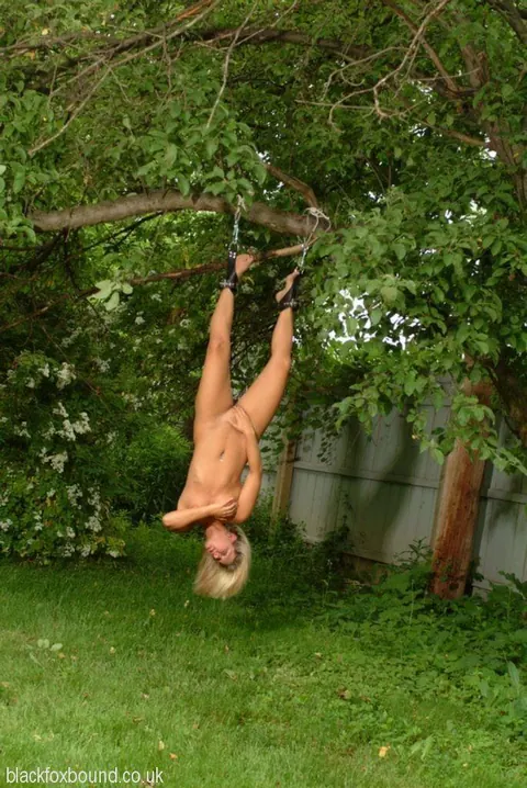 Thick Blonde Hangs Upside Down Bound and Oiled Outdoors – photo 3 of 16