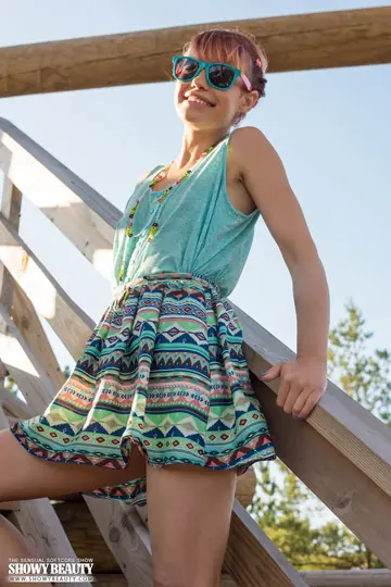 Redhead in Glasses Undresses Outdoors at a Fire Lookout