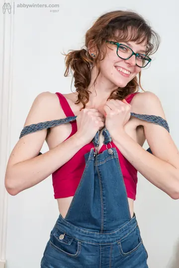 Slim Curly Woman in a Bikini Fingers Her Hairy Pussy and Uses a Dildo