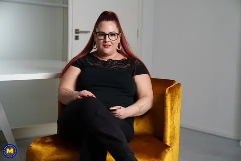 European MILF Teases Cleavage in Glasses – photo 1 of 17