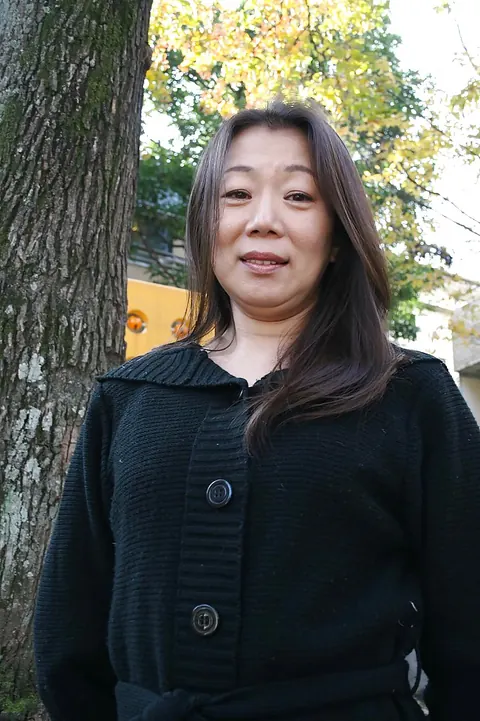 Mature Asian MILF Poses Outdoors in a Skirt – photo 6 of 16