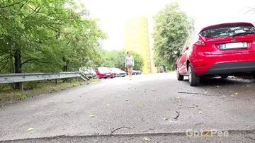 Lara Fox – Thick European Brunette Squats Behind a Car and Spreads Her Legs