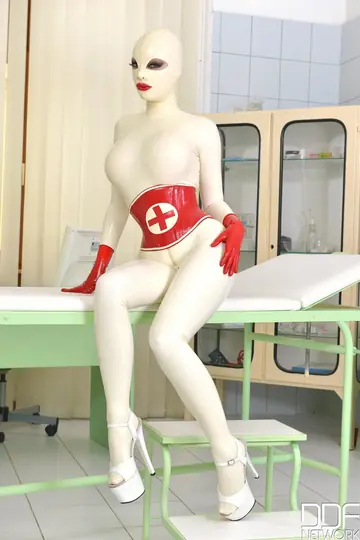 Latex Lucy – Busty British MILF Strips Out of Her Nurse Uniform and Uses a Toy While Bound
