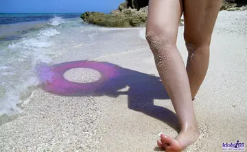 Nao Yoshizaki – Slim Japanese Babe Strips Out of Her Jeans on the Beach