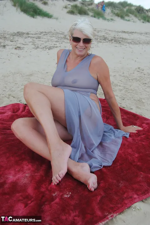 Blonde MILF Models a Sheer Dress on the Beach – photo 15 of 19