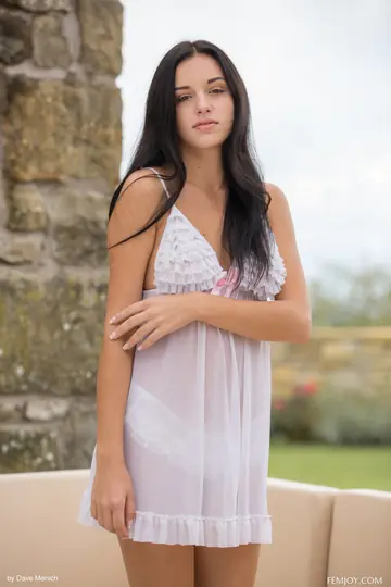 Woman Undresses and Spreads Her Legs on a Sofa Outdoors