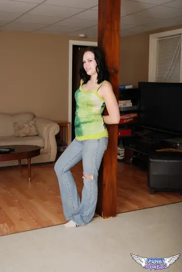 Thick Brunette Strips Out of Her Jeans and Poses Naked Showing Her Big Ass