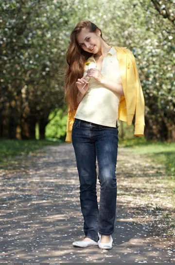 Skinny Woman Strips Out of Her Jeans Outdoors