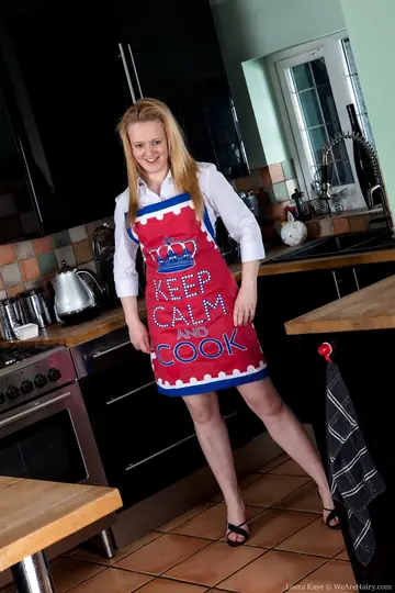 Laura Kaye – British Blonde in a Skirt and Heels Spreads Her Hairy Pussy in the Kitchen
