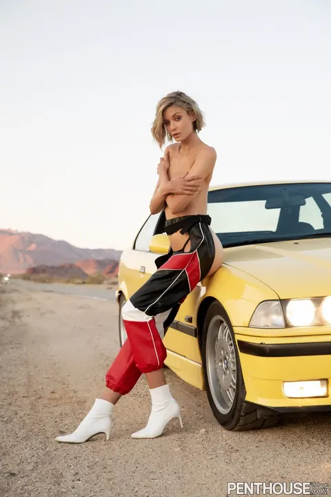 Anna Lisa Wagner: Tall Blonde Shows Off Her Big Natural Tits in Racing Costume by the Car – photo 6 of 17
