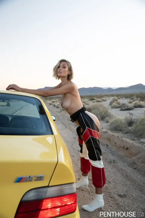 Anna Lisa Wagner: Tall Blonde Shows Off Her Big Natural Tits in Racing Costume by the Car – photo 4 of 17