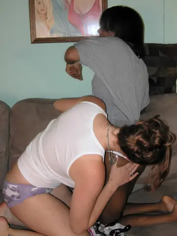 Ebony and White Women Keep Panties On for Lesbian Play on the Sofa
