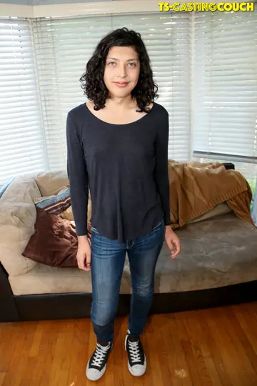 Trans Woman Strips Off Her Jeans and Poses on the Sofa for a Casting