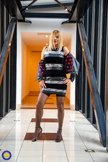 European Blonde MILF Strips Out of Her Skirt and Spreads Her Legs in Stockings