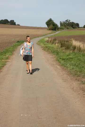 European Woman Teases with Lollipop Outdoors