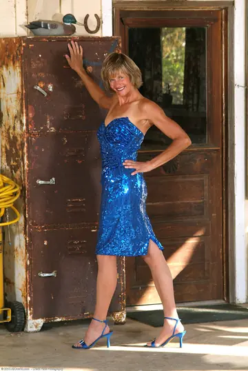 Tall Mature Woman Strips Out of Her Shiny Dress in High Heels