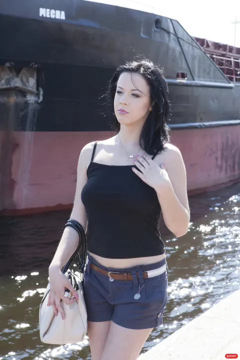 German Brunette Poses in Shorts and High Heels – photo 2 of 15