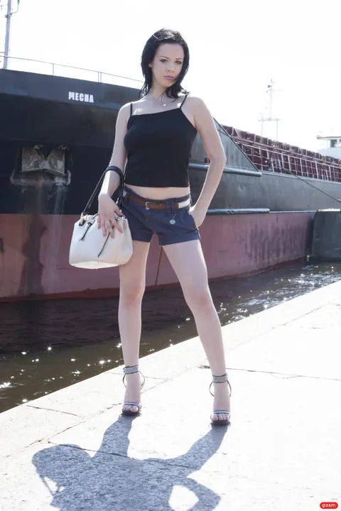 German Brunette Poses in Shorts and High Heels – photo 11 of 15