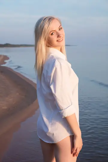 Blonde Walks Naked into the Ocean at the Beach