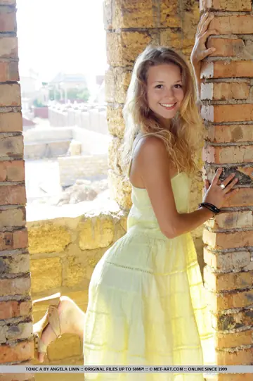 Tall Blonde in a Mini Dress Spreads Outdoors and Shows Her Feet