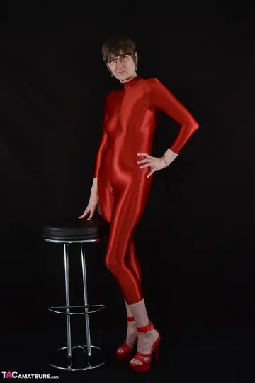Mature PAWG in Glasses Unzips Her Catsuit and Shows Off Her Body