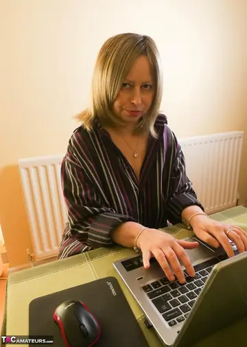 Mature British Blonde Strips Out of Her Lingerie and Stockings in the Office