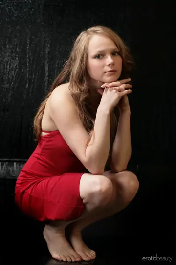 Woman Strips Out of Her Red Dress and Shows Her Shaved Pussy